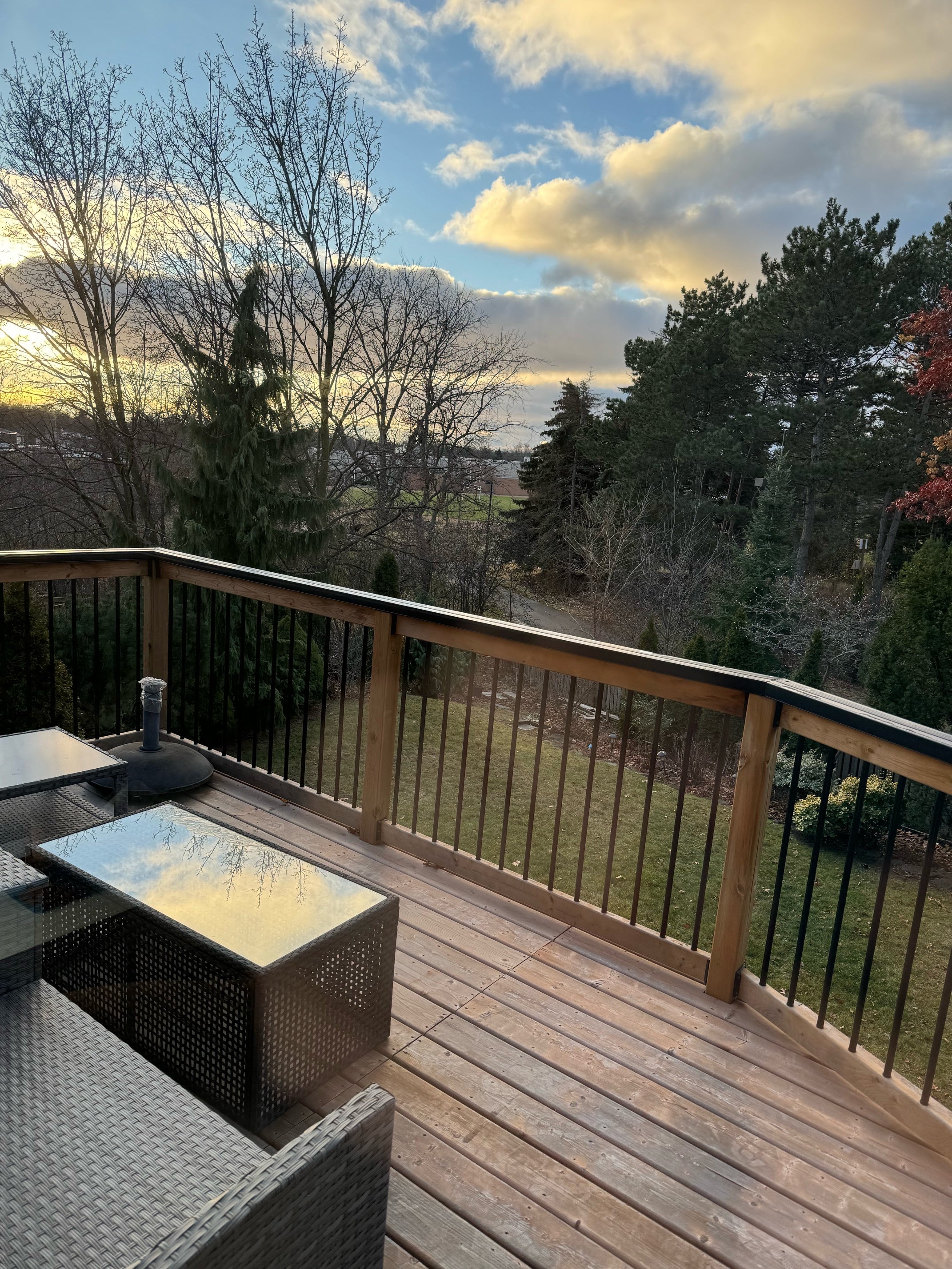 rail shield on a wooden railing at sunrise 