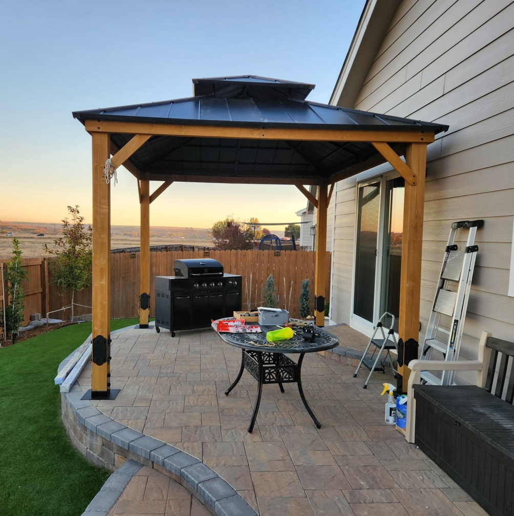 beautiful wooden pergola over pavers using the deck foot anchor with a flat black deck foot anchor plate